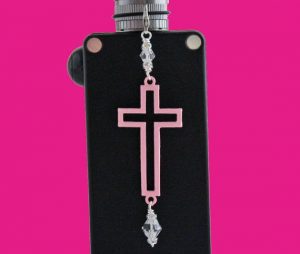 Photo Of A Vape Device With The Symbol Of The Christian Religion On It And Other Religions Symbols Around It